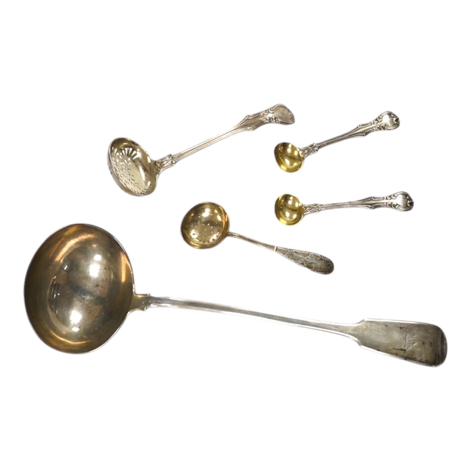 A George IV silver fiddle pattern soup ladle, London, 1827, 32.1cm, together with two sifter spoons (one silver) and a pair of silver mustard ladles. Condition - fair